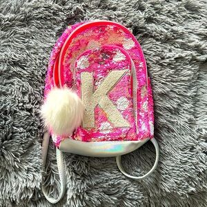 Justice girl backpack with letter K . New never worn.